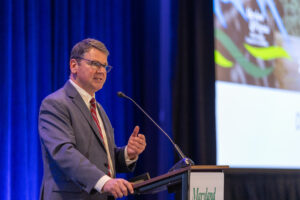 Virginia Secretary of Agriculture and Forestry Matt Lohr speaks to MDVA members about looking at life a little differently to every individual using cards with letters on them as examples during his dinner conversation at the MDVA Annual Meeting on Wednesday, March 27, 2024